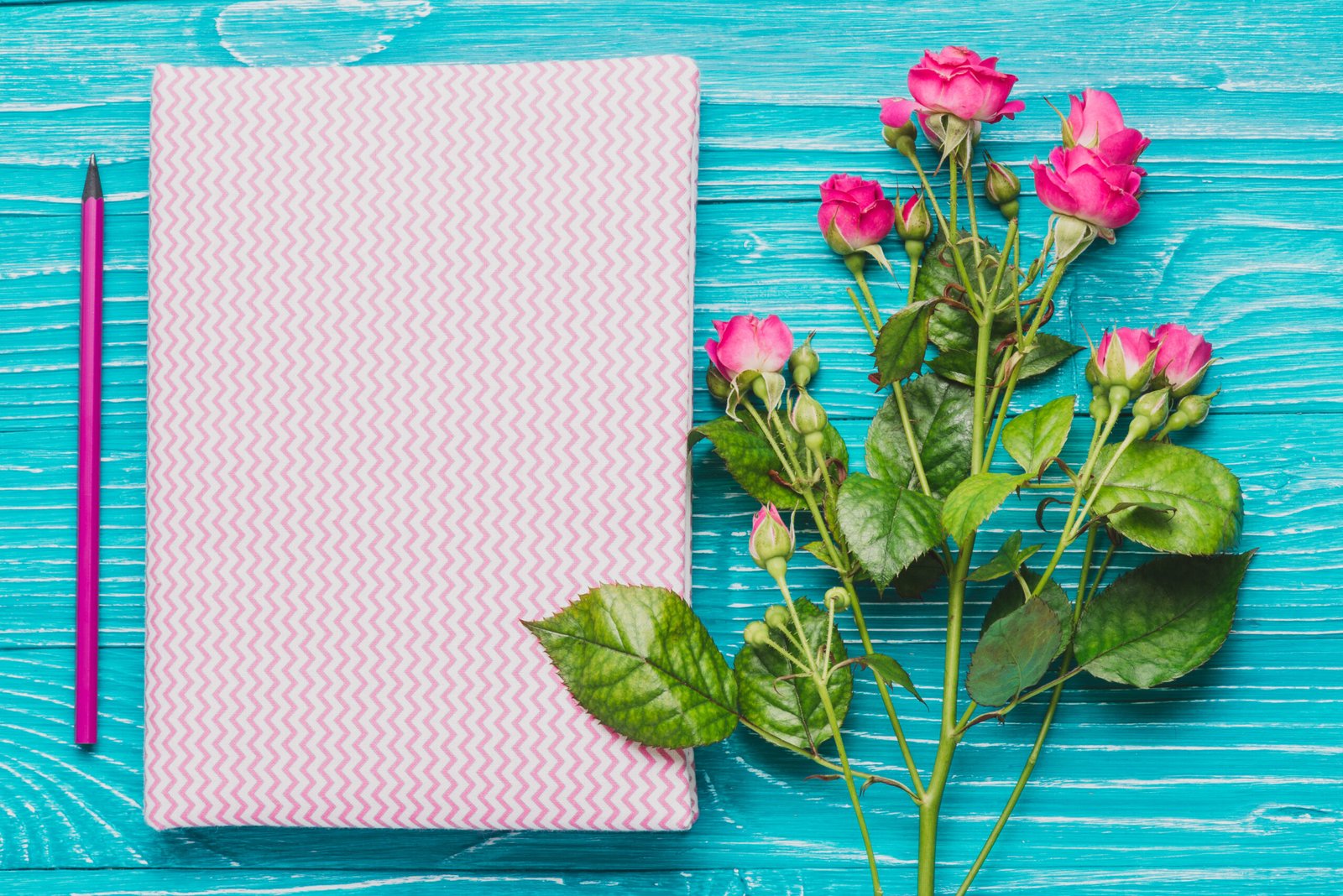 book-decorative-flowers-blue-wooden-surface